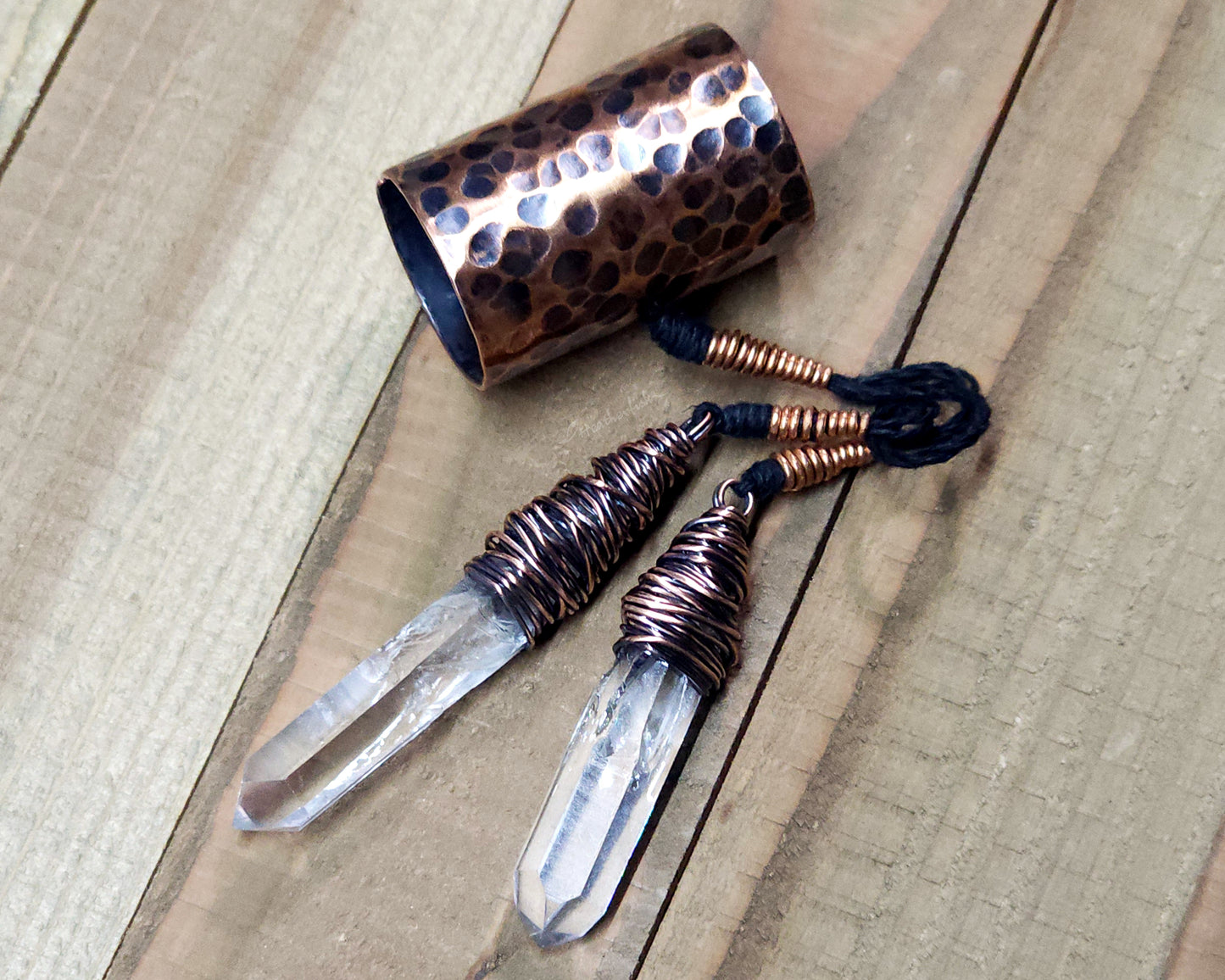 Arkansas Quartz Copper Hair Cuff on a wood background.