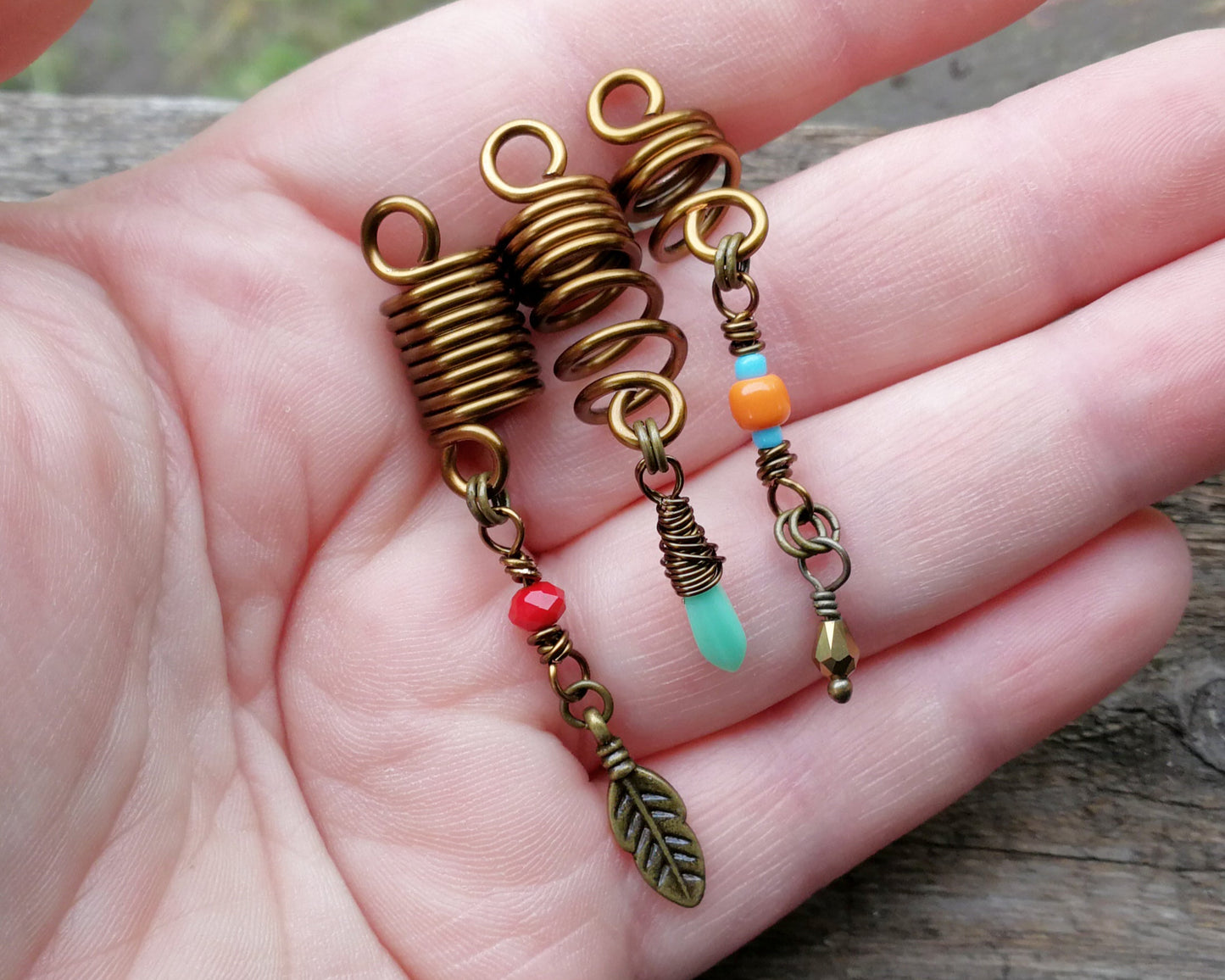 Southwestern hair jewelry set of 3 held in hand to show scale.