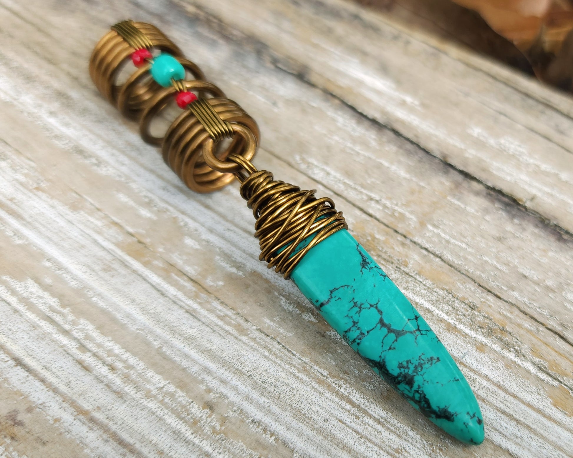 Turquoise hair jewelry on a wood background.