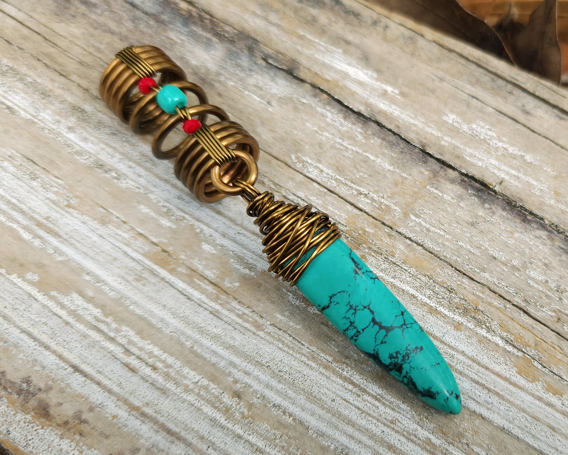 Turquoise hair jewelry on a wood background.