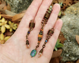 Rainbow, Yellow, Set of 3 Loc Beads held in hand to show scale.