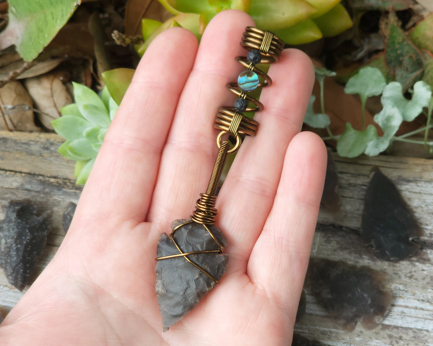 Dark Brown Jasper Arrowhead, Hair Jewelry held in hand to show scale.