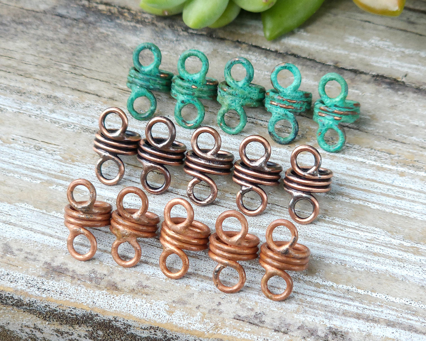 Rustic hair jewelry soldered sets of 5 lined up on a wood background to show finish options.