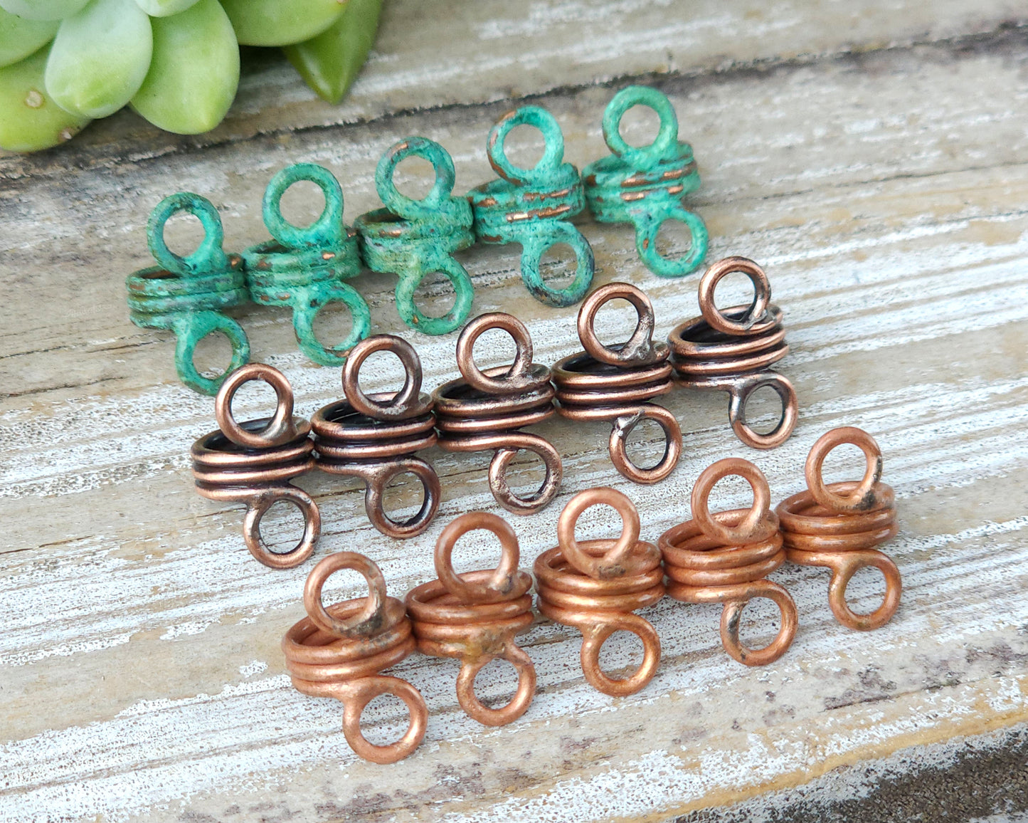 Rustic hair jewelry soldered sets of 5 lined up on a wood background to show finish options.