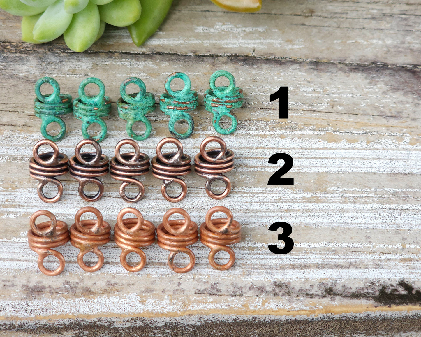 Rustic hair jewelry soldered sets of 5 lined up on a wood background to show finish options.