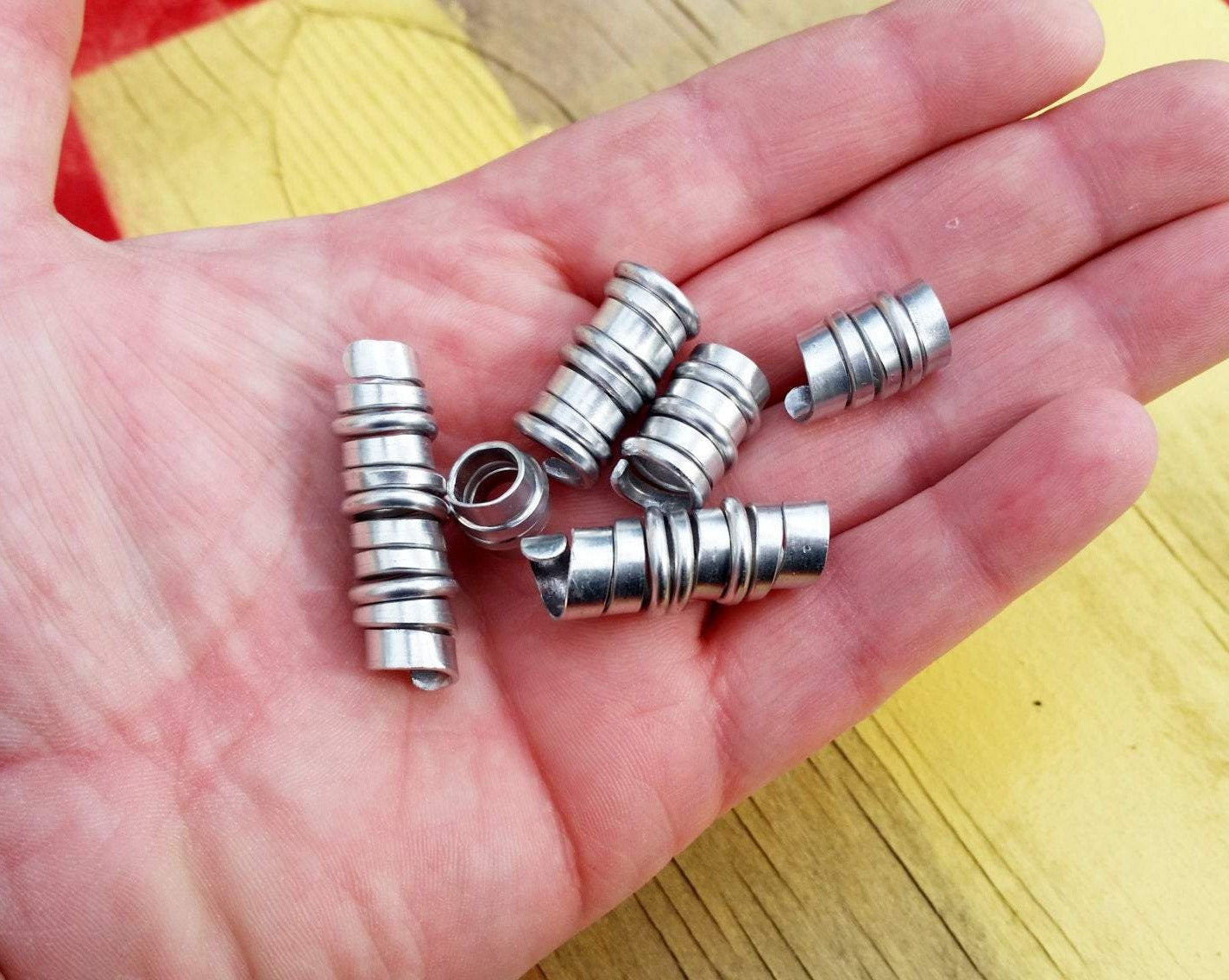 A top view of Hammered Dread Beads Set of 6 in hand.