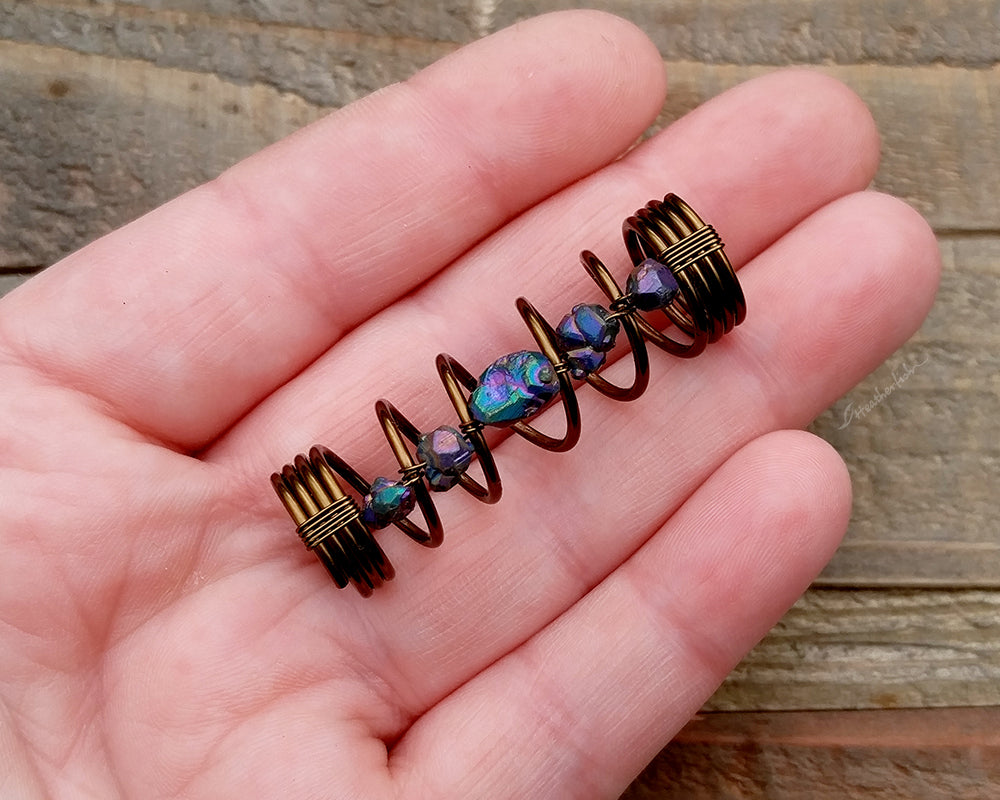 A top view of a Titanium Quartz Dread Bead in hand.
