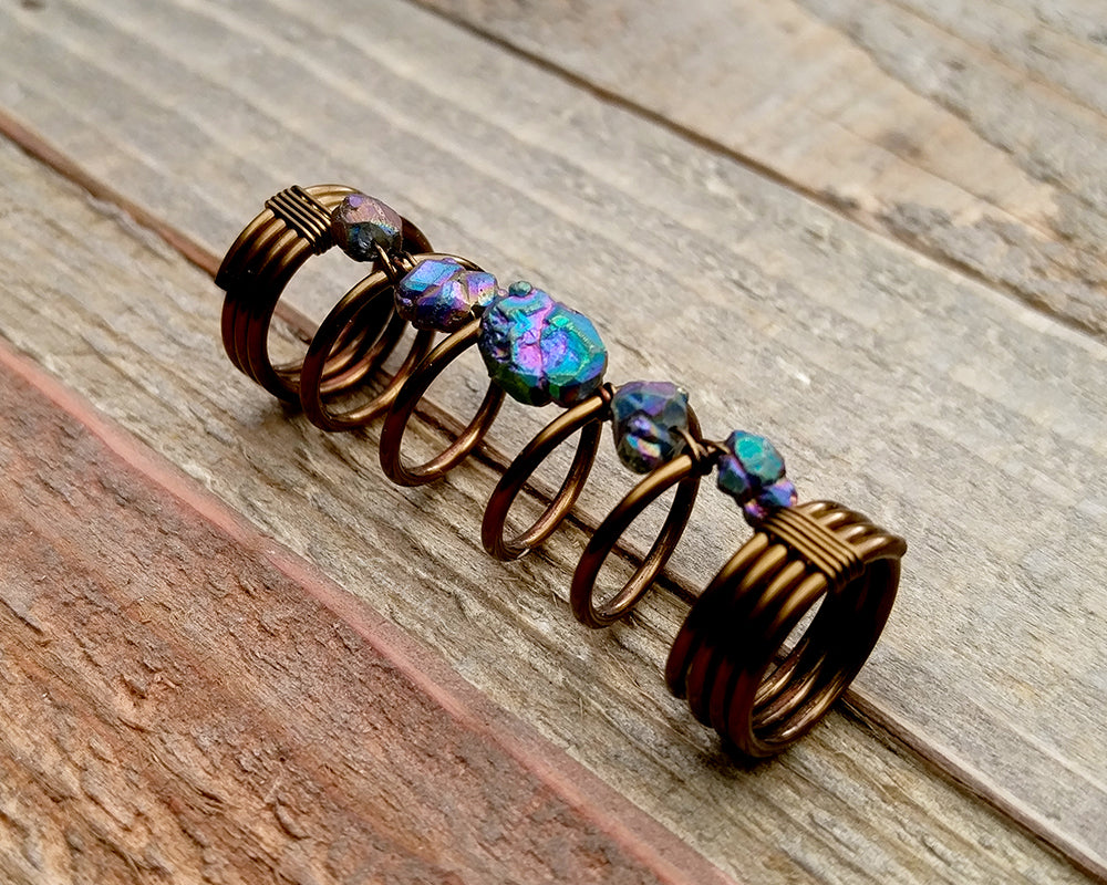 A side view of a Titanium Quartz Dread Bead.