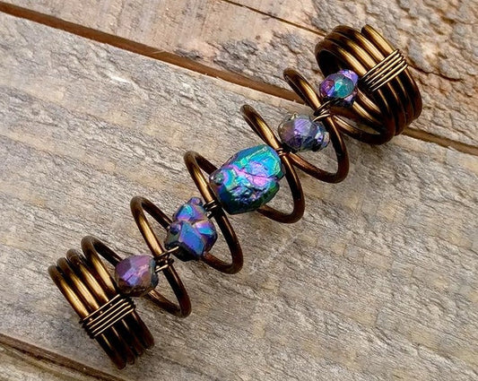 A close up view of a Titanium Quartz Dread Bead.
