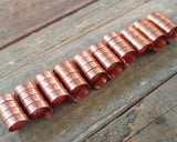 A roll of Copper Dread Beads Set of 10