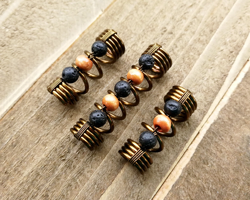 A top view of Diffuser Dread Bead Set of 3 on a wooden background.