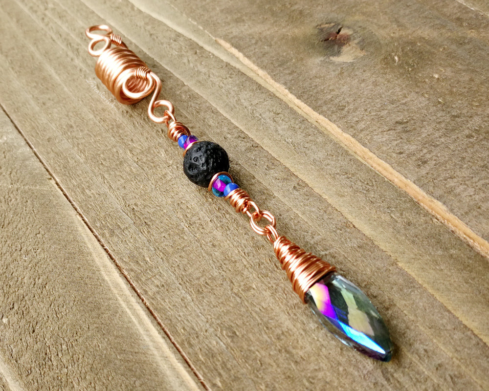 Diffuser Dread Bead displayed on a wooden background.