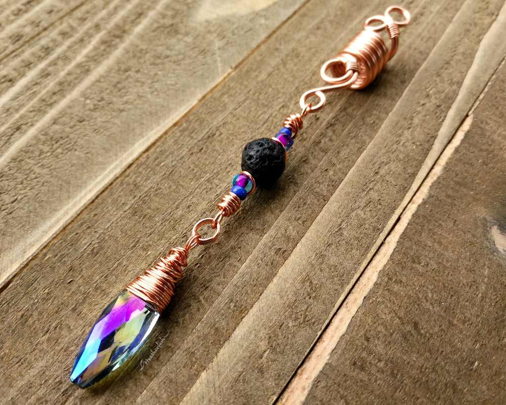 Diffuser Dread Bead displayed on a wooden background.