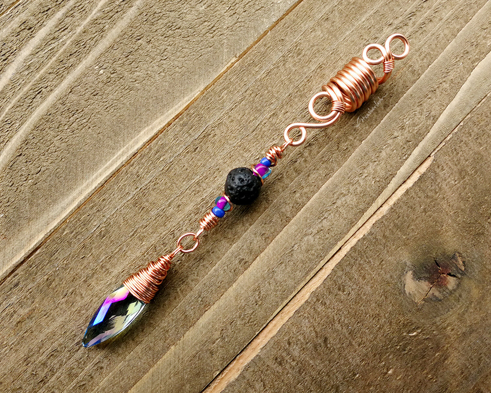 Diffuser Dread Bead displayed on a wooden background.