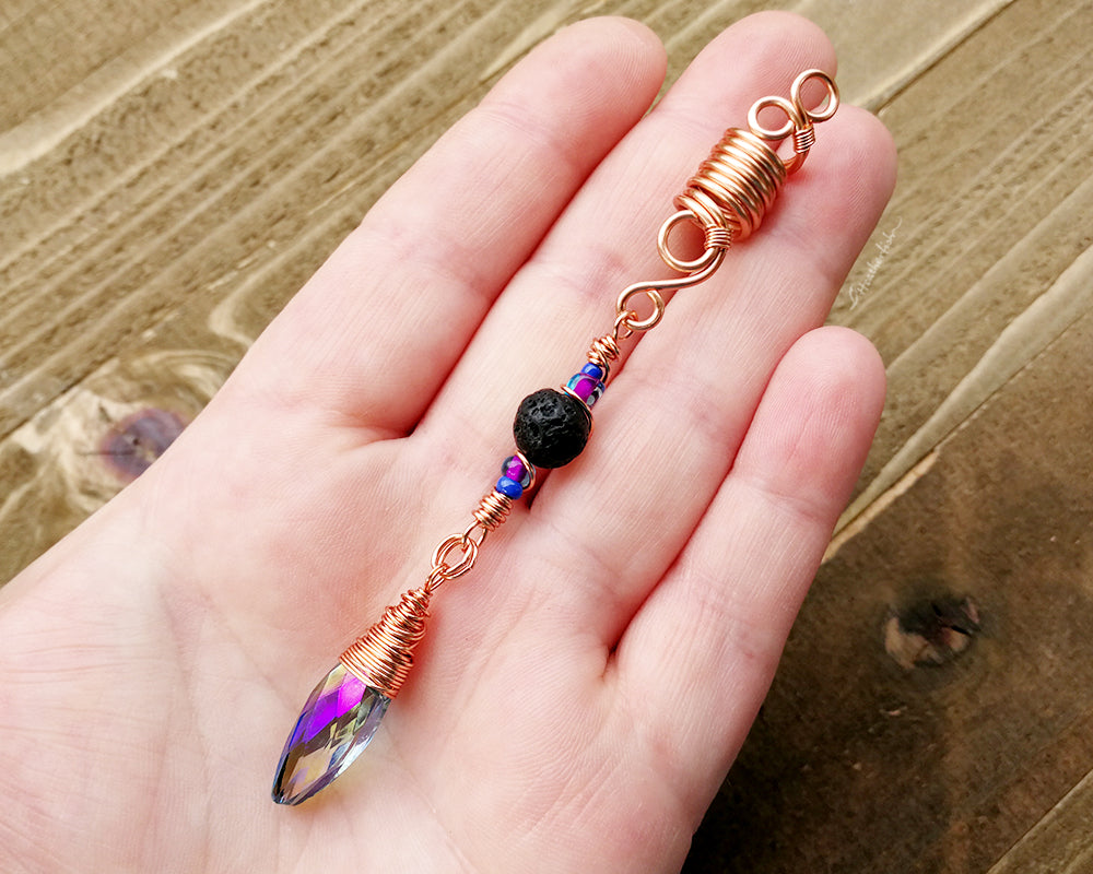 Diffuser loc bead displayed in a hand to show scale.