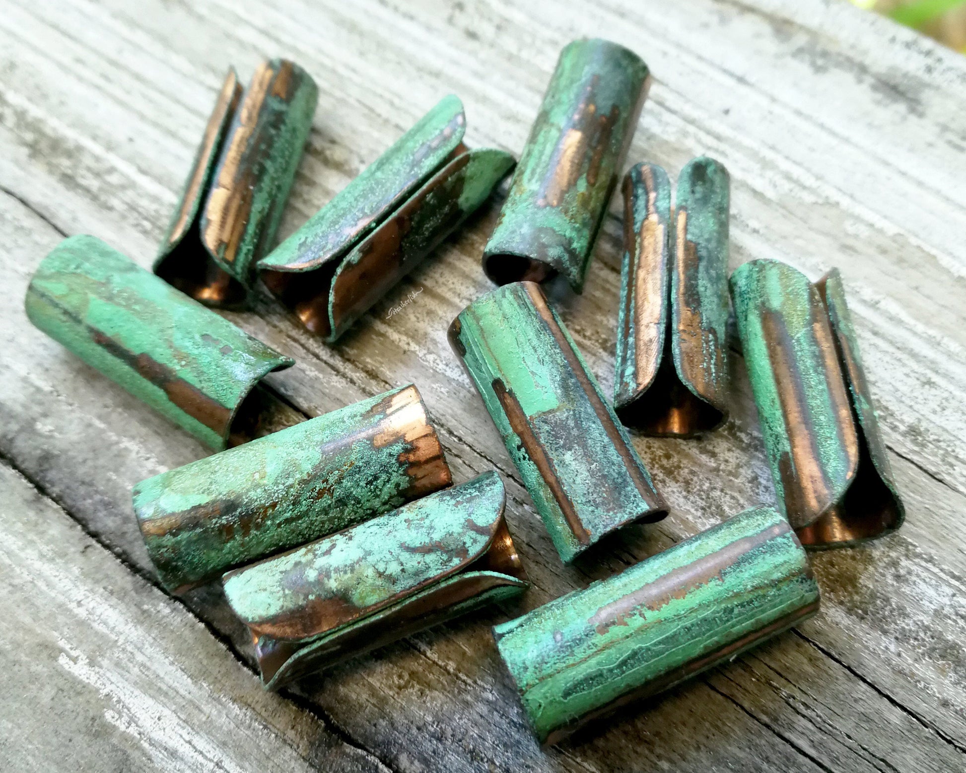 A top view of Green Patina Copper Tube Beads.