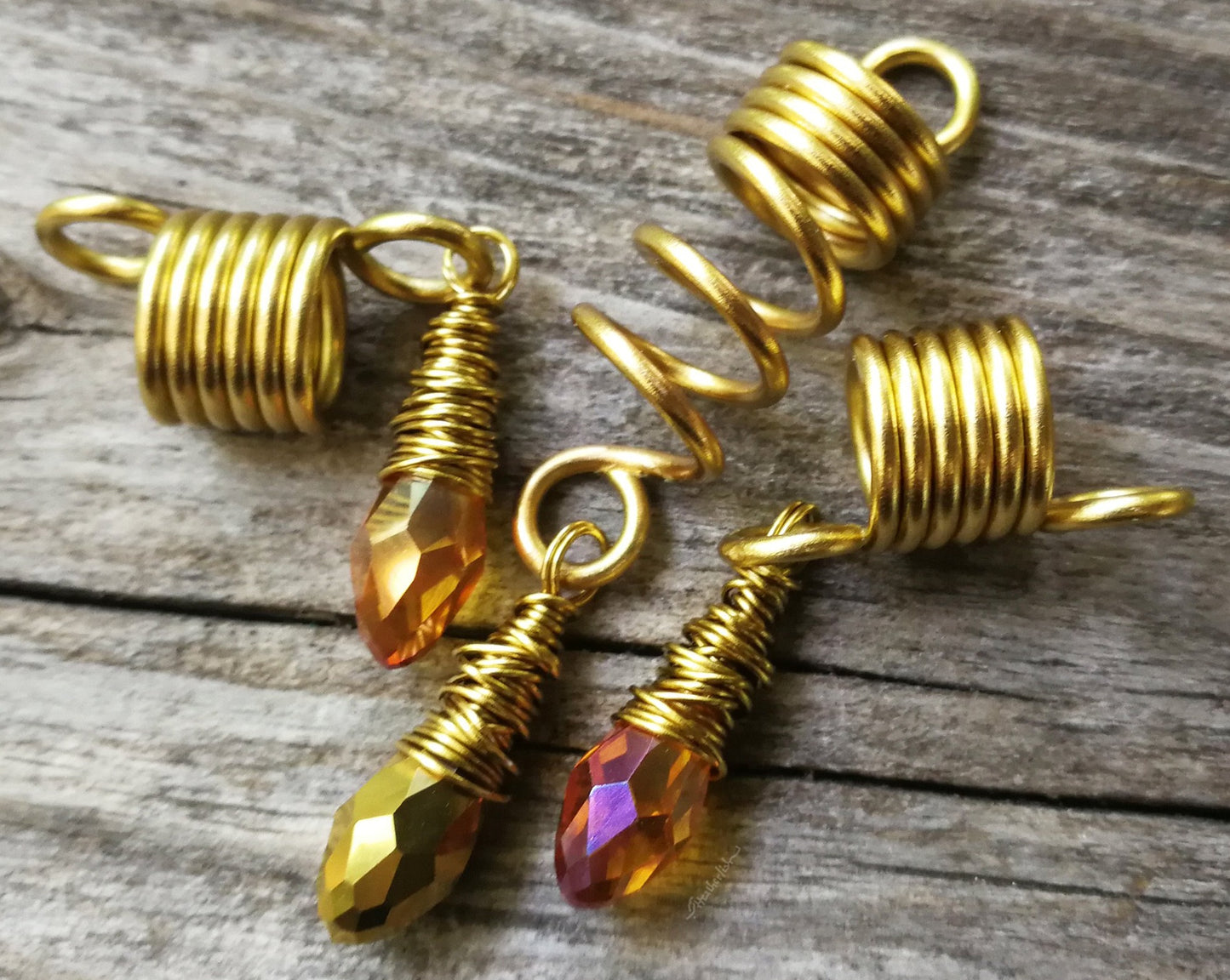 Amber and gold dread bead set of 3 displayed on wood background