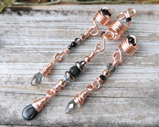 Rose Gold Black Loc Beads, Set of 3, on wood background.