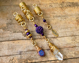 Quartz Set of 3 Dread Beads, brass color option, on a wood background.