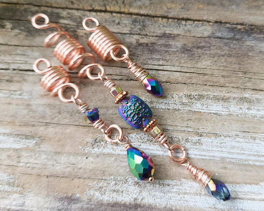Rose Gold Rainbow Loc Beads Set on a wood background.