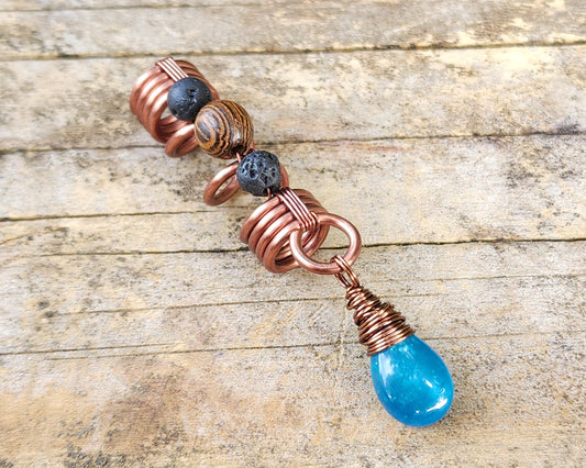 Neon Blue Apatite Loc Bead on a wood background