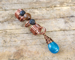 Neon Blue Apatite Loc Bead on a wood background