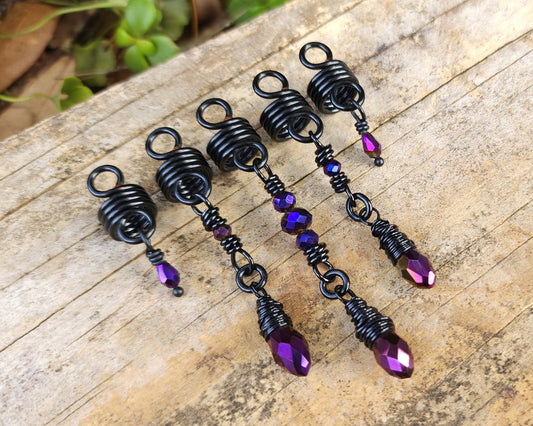Purple and Black Loc Beads, Set of 5 on a wood background.