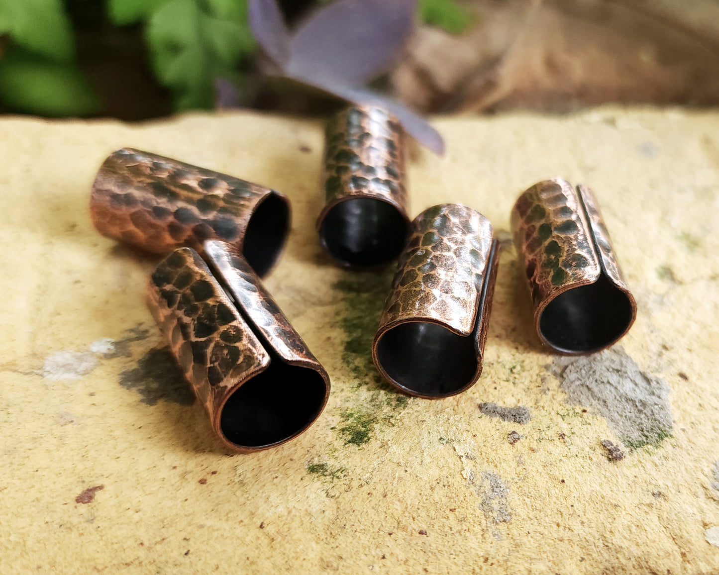 Textured Oxidized Copper Cuffs on a brick background.