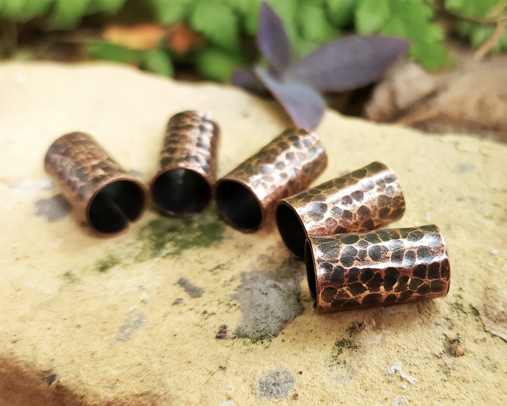 Textured Oxidized Copper Cuffs on a brick background.