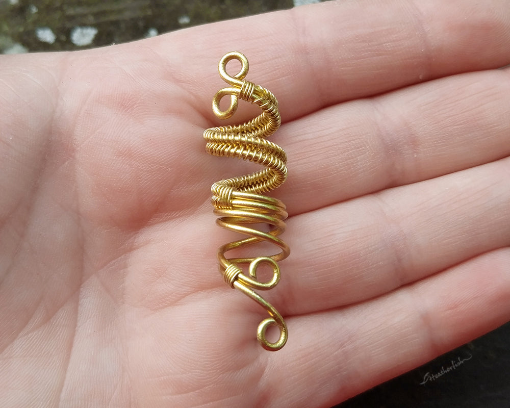 Artisan Woven Dread Bead in Hand