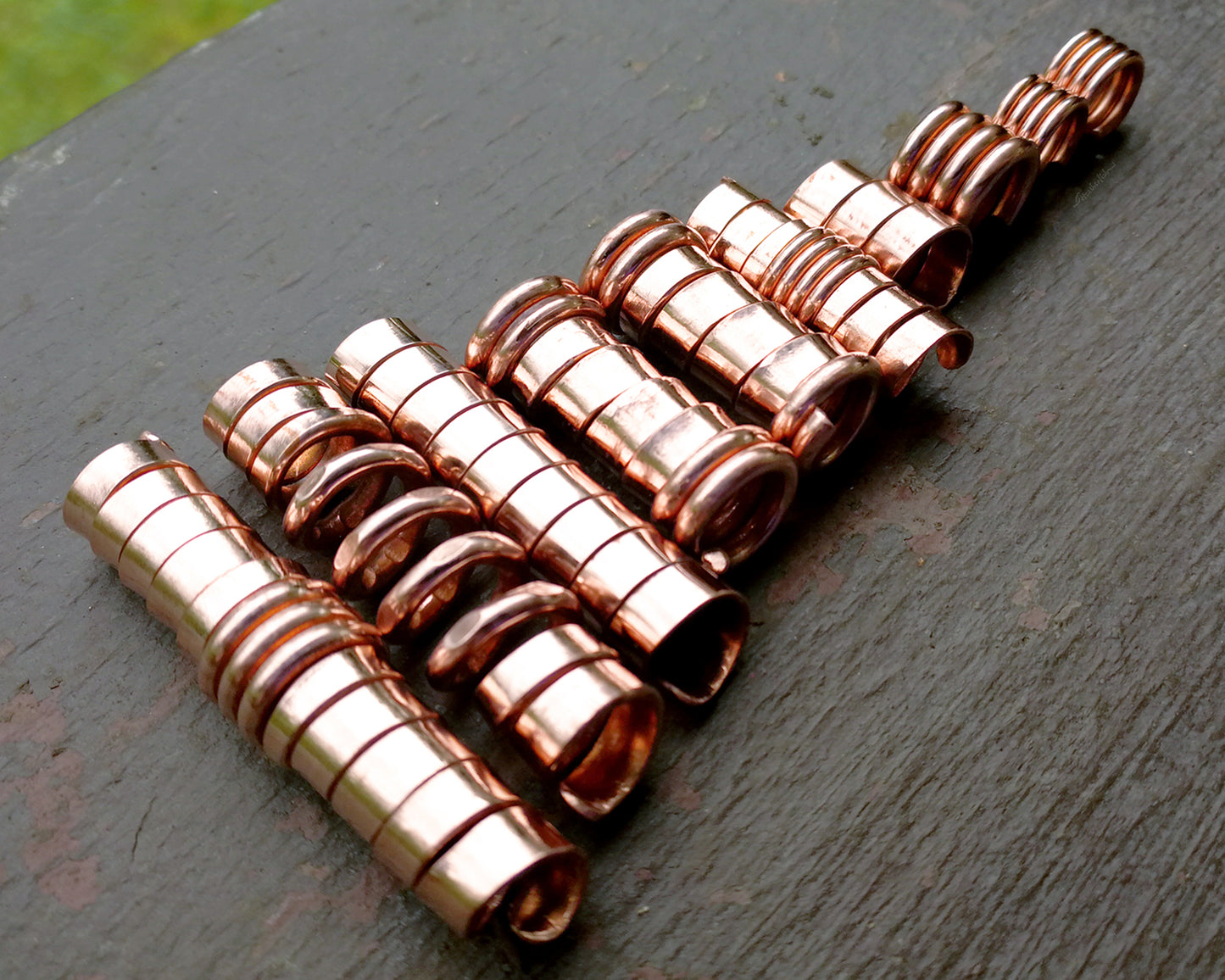 A roll of Stylized Dread Beads Set of 10.