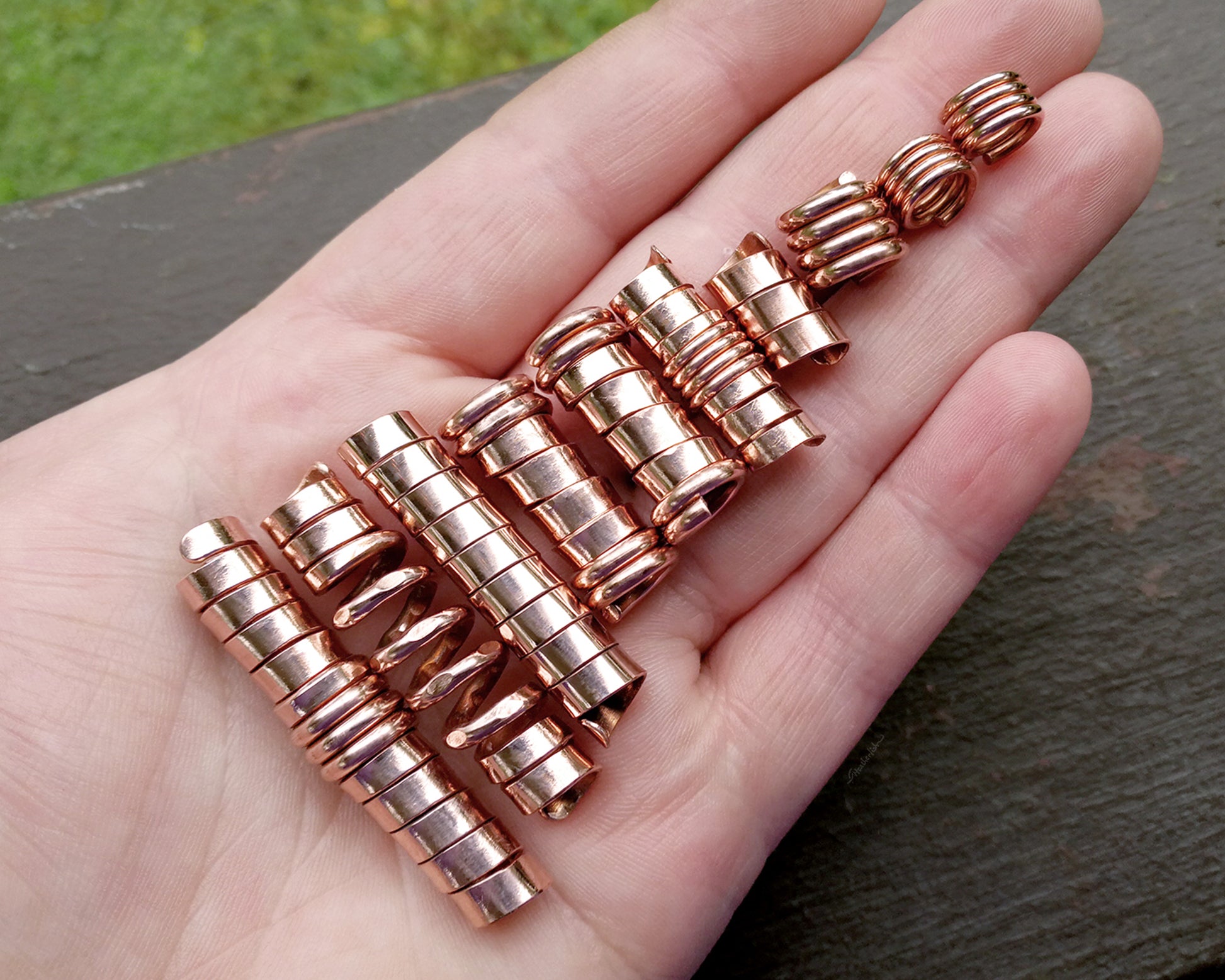 A top view of Stylized Dread Beads Set of 10 in hand.