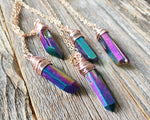 Chunky Rainbow Titanium Quartz Necklace on a wood background.