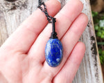 Lapis Lazuli Necklace, Black Chain held in hand to show scale.