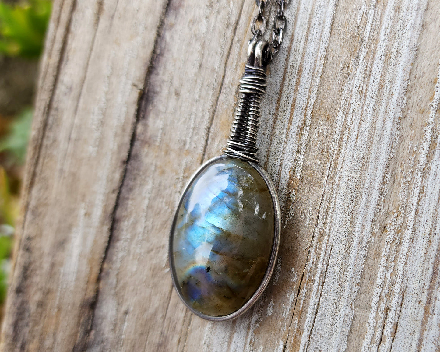Blue Labradorite Pendant, Filled Silver on wood background.