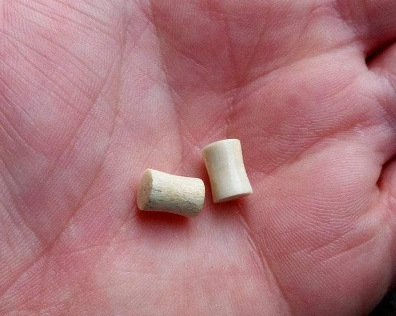 A top view of Handmade Antler Plugs in hand.