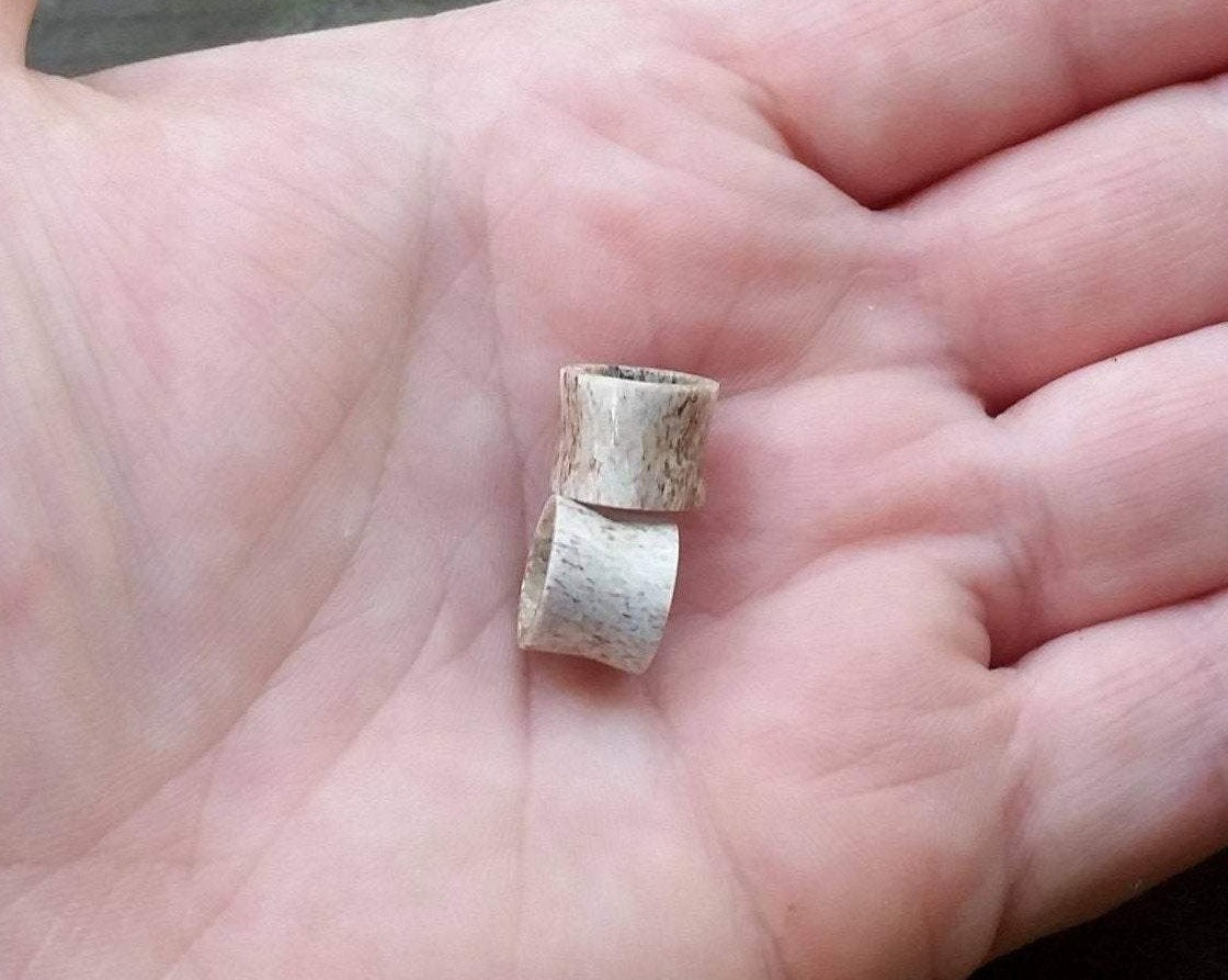 A top view of Handmade Antler Tunnels in hand.