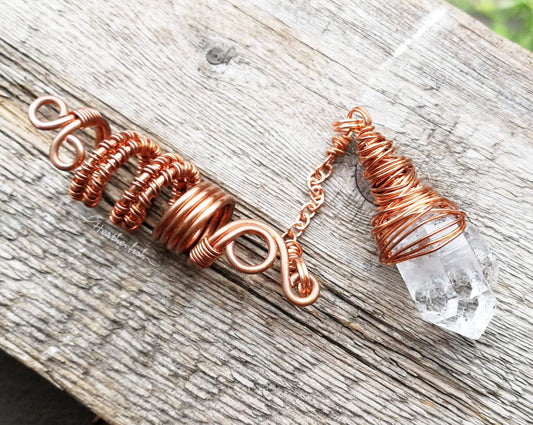 A close up view of a Woven Dread Bead with Arkansas Quartz.