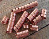 Close up top view of Copper Dread Beads Set of 10 in Varied Length.