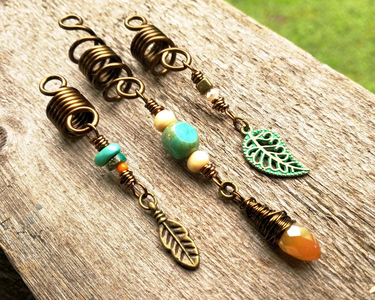 A top view of Leaf Dread Beads set of 3 on a wooden background.