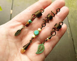 A top view of Leaf Dread Beads set of 3 in hand.