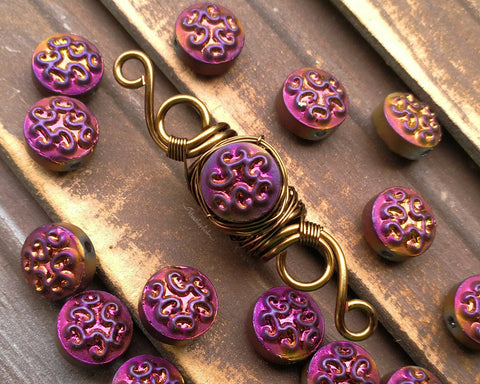 A close up view of Purple Czech Glass Dread Bead.