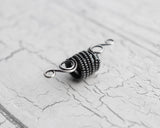 A back view of a Elegant Silver Dread Bead. 