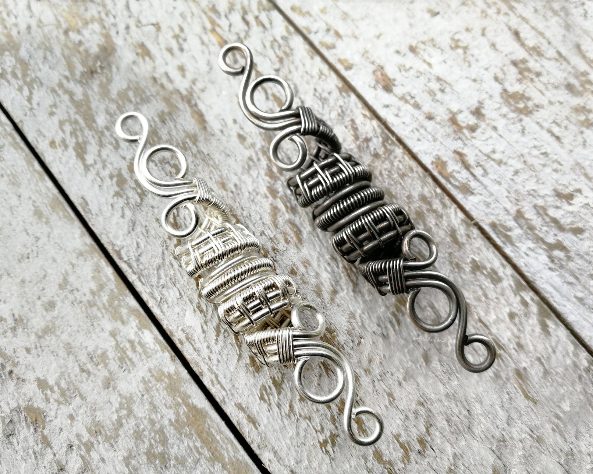 A top view of Silver Filigree Dread Bead with a side by side comparison of different finishes.