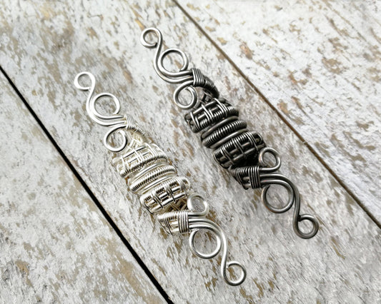 A top view of Silver Filigree Dread Bead with a side by side comparison of different finishes.