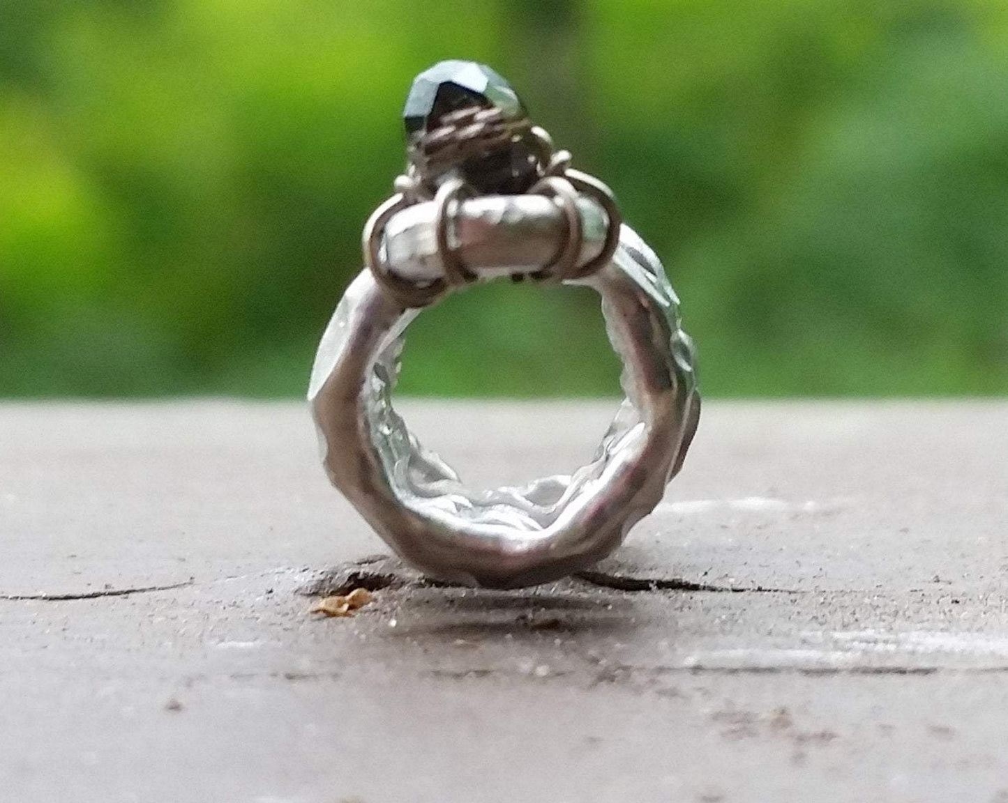 A front view of a Textured Aluminum Dreadlock Bead.