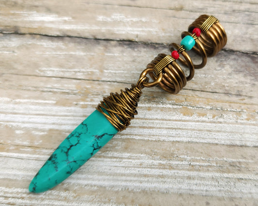 Turquoise hair jewelry on a wood background.