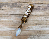 Pearl Moonstone Loc Bead on a wood background.