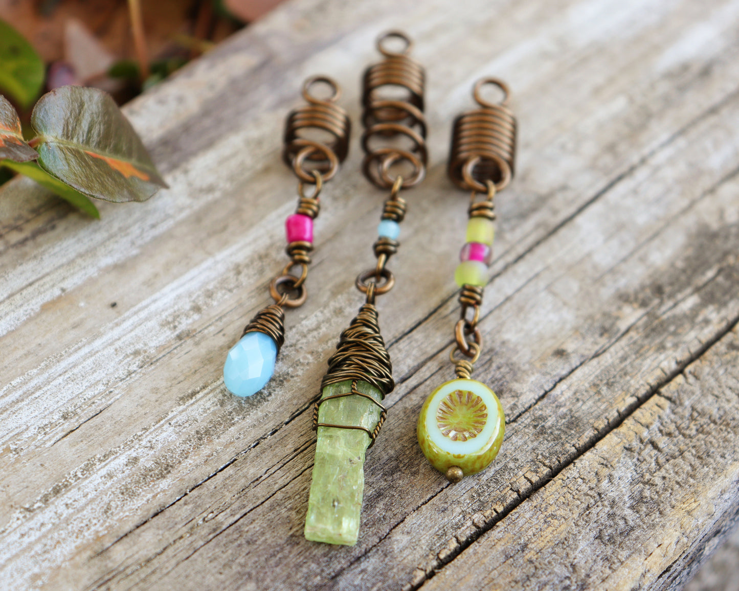 Spring themed set of three hair beads on a wood background.