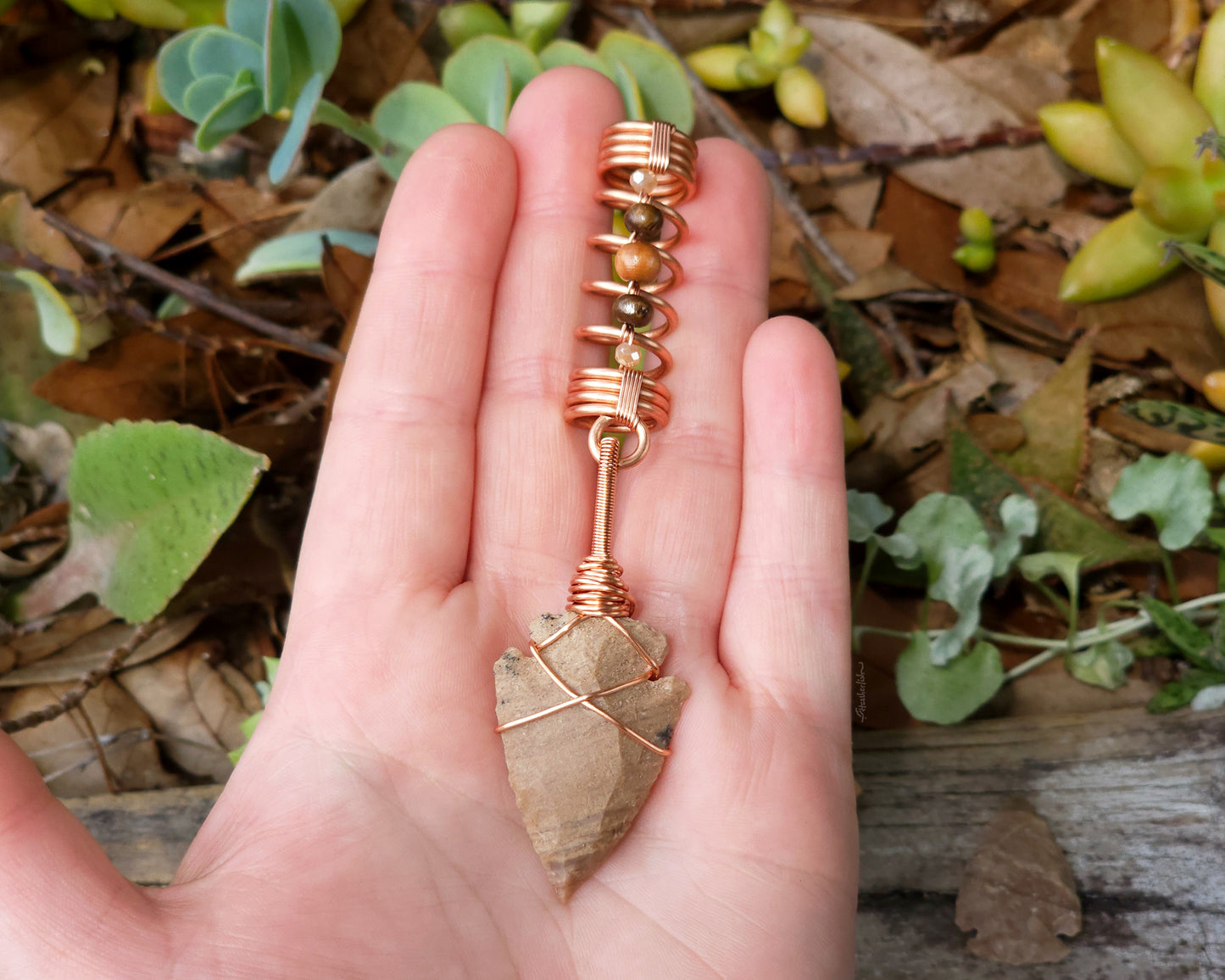 Beige Jasper Arrowhead, Hair Jewelry held in hand to show scale.